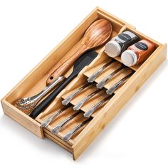 a wooden box with utensils in it