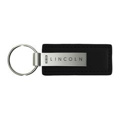 a black leather keychain with the name lincoln on it