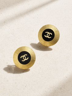 Chanel's vintage earrings date back to 1995, proving their enduring and timeless design. Sourced by Susan Caplan and in near-mint condition, they're cast from gold-plated metal and have glossy enamel centers with the iconic 'CC' emblem. The halo of ribbing reflects the light softly, while clip fastenings ensure they're comfortable whether your lobes are pierced or not.   This Chanel item has been authenticated by Susan Caplan. Susan Caplan is not affiliated or endorsed by Chanel. Black Channel Earrings, Chanel Dangle Earrings, Black Chanel Earrings, Vintage Chanel Jewelry, Vintage Chanel Earrings, Luxury Vintage Enamel Clip-on Earrings, Flat Dress Shoes, Chanel Earrings, Room Fragrances