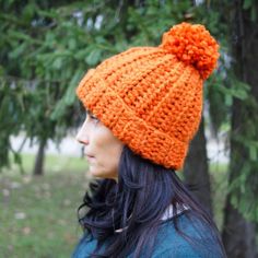 a woman wearing an orange knitted hat