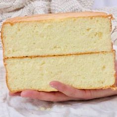 two slices of white cake being held by someone