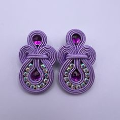 Description: Statement Soutache Earrings These Items Are Individually Made With Love By Me. Details: Handmade Item These Trendy Soutache Earrings Are 100% Handmade And Have One-Of-A-Kind Designs. Color: Purple Material: Viscose Cords & Beads Metal: Stainless Steal Dimensions: 2" X 1" Style: Elegant/ Boho Chic / Stylish Care Instructions: Store Out Of Direct Sunlight And Keep Away From Water. It Is Not Recommended To Wear These Earrings In Or Around Water. Soutache Tutorial, Soutache Embroidery, Embroidery Earrings, Evening Earrings, Soutache Necklace, Soutache Earrings, Stainless Steal, Soutache Jewelry, Stylish Earring