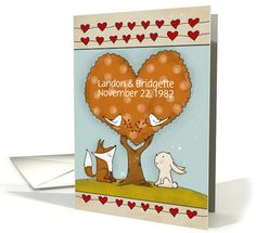 a card with an image of two dogs and a tree in the shape of a heart