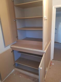 an empty closet with shelves and no doors