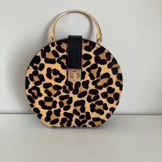 Nwot Dune London Round Animal Print Calf Hair Leather Purse. The Front Has A Latch And Twist Lock. Gold Hardware. Removable Crossbody Strap. Measures Approx 8 Across And 8.5 Across, 3.5 Wide, And 27 Inches Around. The Handle Drop Is Approximately 3 Inches. The Crossbody Shoulder Strap Is Approximately 24.5 Inches At Its Longest And Adjusts To Approximately 15.5 Inches. Questions? Leave A Comment Below! London Bags, Dune London, Calf Hair, Leather Purse, Crossbody Strap, Leather Purses, Gold Hardware, Black Color, Animal Print