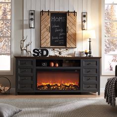 a fireplace in a living room with a chalkboard on the wall above it that says home