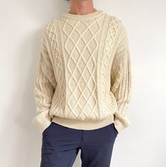 Classic vintage men's Aran knit jumper in natural cream colour, made from pure new wool. It has a cozy round neck and a classic, relaxed sweater shape. It is fairly thick, yet breathable and lightweight, and has a woolly bite to it. Perfect for that comfy, classy heritage look, all year round. Made in The UK by St. Michael. 100% pure new wool. Large size labelled as 44/56. Measurements when laid flat are: Pit to pit: 64cm Waist: 58cm Waistband: 44cm Length: 66cm Excellent condition. E* Classic Chunky Knit Cream Sweater, Cream Chunky Knit Classic Sweater, Classic Cream Chunky Knit Sweater, Cream Relaxed Fit Sweater, Pull Vintage, Aran Knit, Cream Jumper, Pullover Sweater Men, Mens Pullover