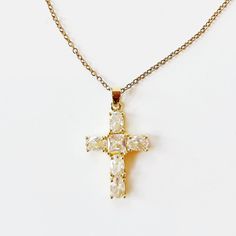 Introducing our Cross My Heart Necklace—a beautifully dainty piece that adds a touch of elegance to any outfit. Crafted in stunning gold, this timeless necklace features a delicate cross design adorned with a hint of sparkle, making it perfect for both everyday wear and special occasions. Lightweight and versatile, the Cross My Heart Necklace is designed for those who appreciate subtle sophistication. Whether you’re layering it with other pieces or wearing it solo, this necklace radiates a warm glow that complements your unique style. Celebrate your faith and express your individuality with this charming accessory. The Cross My Heart Necklace is not just a piece of jewelry; it’s a heartfelt statement that you’ll cherish for years to come. Perfect for gifting or as a special treat for yours Elegant Gold Plated Cross Pendant Necklace, Elegant Cross Necklace With Delicate Chain, Delicate Cross Pendant Necklace For Gift, Delicate Cross Necklace For Gift, Delicate Cross Necklace Perfect As A Gift, Delicate Cross Necklaces For Weddings, Delicate Cross Necklace For Wedding, Dainty Gold Cross Necklace For Anniversary, Delicate Gold Cross Jewelry