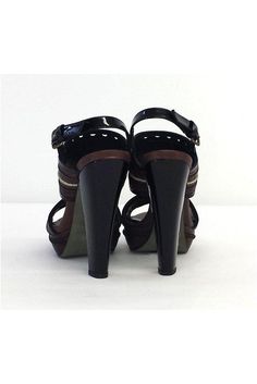 Size 9 EU 39 Brown & Black Sandal Heels Retails for $325 Leather soles Very light wear on outsoles Leather upper Light discoloration mark on back of shoe near heel Made in Spain Patent leather trims Adjustable ankle strap Lightly padded insole Platform height 1.25" Heel height 5" Black Sandals With 4-inch Heel And Round Toe, Formal Sandals With Reinforced Heel And Round Toe, Patent Leather Closed Toe Sandals, Patent Leather Heels With Leather Sole And Round Toe, Patent Leather Sandals With Reinforced Heel And Round Toe, Patent Leather Heels With Round Toe And Leather Sole, Black Heels With Leather Sole, Ankle Strap Heels With Branded Insole, Medium Width, Patent Leather Sandals With Padded Heel And Almond Toe