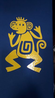 a blue and yellow sign with a monkey on it