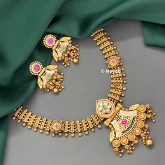 Indian dull gold jewelry set with beautiful meenakari designs. Inspire your style with this real gold look wedding jewlery set with ruby and green stone details. Necklace is made with pure brass in antique gold finish. Pair this necklace with saree or lehenga to complete your look.  All orders Ship same day if placed before 4:00 PM EST  Earring length: 1.45 inch Earring width: 1.25 inch Necklace length: Adjustable with dori closure. Create beautiful memory for any occasion with elegant jewelry f Gold Zari Work Jewelry For Marriage, Green 22k Gold Jewelry Set For Wedding, Green 22k Gold Wedding Jewelry Set, Temple Jewelry Kundan Necklace With Meenakari For Marriage, Temple Jewelry Sets For Marriage With Meenakari, Traditional Green Necklaces For Marriage, Traditional Meenakari Jewelry Sets For Marriage, Traditional Green Kundan Necklace For Marriage, Traditional Gold Jewelry