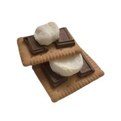 three pieces of chocolate and marshmallow on a plate