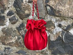 🔘 This Elegant Satin Ruffle bag is ideal for the wedding day, night out, party, special occasion, brides, bridesmaids, mothers of the bride, or any formal fun. 🔘 This bag has an elastic opening and a stiff bottom.   🔘 Please contact us for a custom order. 🔘 Material: Satin fabric, lace. The lining fabric is the same fabric as on the outside.  🔘 Measurements: The bottom diameter is 15 cm/6 inches & Height is 19 cm /7.5 inches 🔘 Care instruction: Hand wash in Luke water. Valentine's Day Evening Handheld Shoulder Bag, Elegant Handheld Shoulder Bag For Valentine's Day, Red Clutch Shoulder Bag For Events, Elegant Red Shoulder Bag Gift, Elegant Handheld Bag For Valentine's Day, Elegant Bags With Removable Pouch For Valentine's Day, Chic Bags For Valentine's Day Event, Red Wedding Pouch Clutch, Red Clutch With Removable Pouch For Party