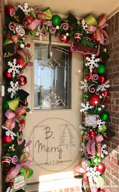 the front door is decorated with christmas decorations