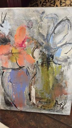 an abstract painting with flowers in a vase