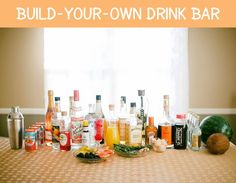 a table topped with lots of bottles and glasses