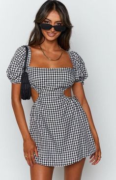 This flirty little number is perfect for those sunny days and warm nights. With its classic gingham print, it’s giving major picnic-in-the-park vibes, but the cut-out back adds just the right amount of sexy. Whether you’re heading to brunch with the girls or a cute date night, this dress is your go-to for effortless style. Pair it with your favorite sandals or sneakers, and you’re ready to slay the day! Fit and Features Open back that ties Mini length Puff sleeves Ties on the sides Runs true to Short A Line Dress, Line Dresses, Sundress Dress, A Line Dresses, Short Sleeve Mini Dress, Tie Dress, Fashion Colours, Mini Dress With Sleeves, Mini Dress Party