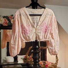 Beautiful And Unique Loveshackfancy Florence Top In A Peachy Seashell Pink Color With Pink Embroidery. Loop Buttons Up The Front And On Sleeves. Cropped With Frayed Edge. Size: Medium Pink Bohemian Blouse For Daywear, Pink Bohemian Peasant Top For Beach, Pink Peasant Beach Top, Pink Bohemian Peasant Top For Spring, Pink Long Sleeve Peasant Top For Spring, Pink Peasant Top For Beach, Pink Long Sleeve Blouse For Festival, Pink Feminine Peasant Top For Summer, Feminine Pink Peasant Top For Summer