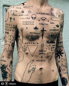 a man with many tattoos on his chest