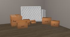 cardboard boxes and mattresses in an empty room