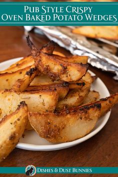 a white plate topped with oven baked potato wedges