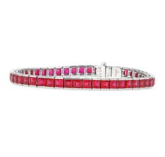 Dazzling rubies are channel-set into this elegant line bracelet. Dozens of crimson gems, weighing a total of 13.35 carats, exhibit a beautifully matched, fiery sparkle, which is flawlessly complemented by approximately 0.05 carats of diamonds in a platinum setting. 7 1/4" length Golconda Diamond, American Illustration, Jewelry For Sale, Bracelet Display, Ruby Jewelry, Post Impressionists, Fine Jewels, Channel Set, Blue Diamond