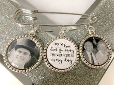 two silver bracelets with pictures of people in them on top of a glitter surface