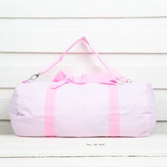 This weekend duffel comes with a shoulder strap for easier travel and a side zipper pocket to hold smaller items. Add a monogram to personalize this perfect travel accessory! 20.5" x 16" Sleepover With Friends, Weekend Duffle Bag, Pink Seersucker, Grandma's House, Grandmas House, Easy Travel, Monogram Styles, Duffel Bag, Pink Bag