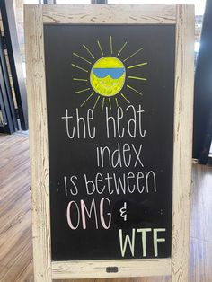 a sign that says the heat index is between omg and wft on it