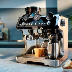 an espresso machine sitting on top of a counter