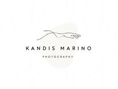 the logo for kandis marina photography, which is located on top of a hill