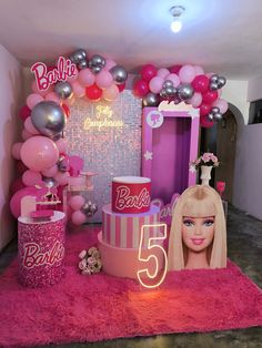 a barbie birthday party with balloons and decorations