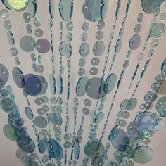 PRICES MAY VARY. LIGHTWEIGHT and STURDY : This circular flat discs door curtain is made out of high-quality acrylic beads and features 23 strands which are about 1 Inch 1/4 apart, All strands are hanging from one rod. VERSATILE : This beads curtain door can be used over an existing door or a window, as a closet curtain, room divider, for weddings and events, or in retail locations as a cool window display. Use for just about any door way – use your imagination! EASY INSTALLATION : Each beaded cu Door Beads Aesthetic, Mermaid Inspired Room, Sea Themed Room Aesthetic, Ocean Themed Bedroom For Kids, Ocean Themed Room Decor, Ocean Themed Decor, Ocean Themed House, Oceancore Room, Mermaid Core Room