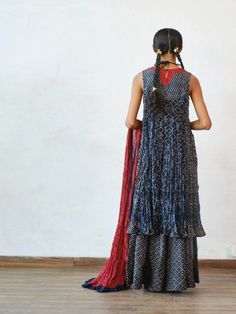 Crushed printed chanderi kurta with kathiawadi embroidered yoke paired with palazzo pants and crushed chanderi dupatta Color: Indigo Fabric: Chanderi Note: The product will be delivered within 3-4 weeks of order placed Wash care - Dry clean only The size can be cutomised Additional charges of 10% on MRP shall be charged for sizes - XL, 2XL, 3XL, 4XL, 4XL and 6XL Size Chart (In Inches): XS S M L XL 2XL 3XL Bust 32 34 36 38 40 42 44 Waist 25 26 28 30 32 34 34 Hips 35 37 39 41 43 45 47 Designer Bandhani Print Palazzo Set For Navratri, Designer Georgette Palazzo Set With Bandhani Print, Designer Bandhani Print Anarkali Set In Georgette, Designer Georgette Anarkali Set With Bandhani Print, Chanderi Sharara For Transitional Season, Traditional Bandhani Print Palazzo Set For Designer Wear, Traditional Drape Palazzo Set With Bandhani Print For Diwali, Straight Kurta Sharara With Sheer Dupatta In Mulmul, Straight Kurta Sharara With Sheer Dupatta