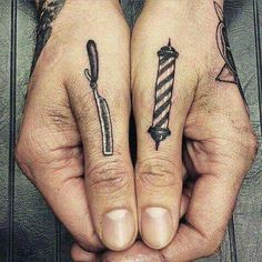 two people with matching tattoos on their hands