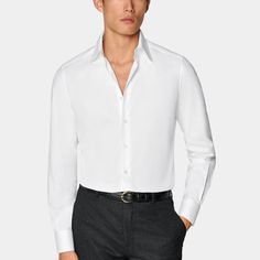 This crisp white button-up is tailored to a tailored fit and features a large point collar and single cuff-a classic style that's perfect for any formal look. Timeless Shirt With Lapel Collar For Office, Elegant Single Breasted Collared Shirt, Tailored White Tops For Formal Occasions, White Tailored Top For Formal Occasions, Elegant Single-breasted Collared Shirt, Elegant Single Breasted Top With Spread Collar, Elegant Single-breasted Top With Spread Collar, Formal Custom Fit Long Sleeve Shirt, Timeless Collared Dress Shirt With Concealed Placket