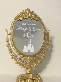 an ornate gold mirror with the words be our guest on it