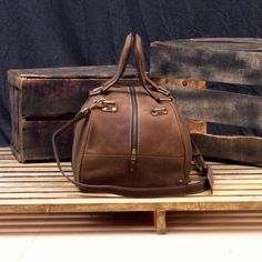 "DIMENSIONS: 10.5\"H x 19\"L x 10.5\"D x | 26.5 cm H x 48 cm L x 26.5 cm D CAPACITY : 34 L The Vintage Leather Duffel Bag For Men is the ultimate rebirth of antique style leather bag. We designed it with high quality top grain leather from cowhide. The vintage travel bag is designed to keep all your essentials centralized for a weekend. This leather duffle bag lets you work on-the-go with its extra laptop pocket made from a special cushion protection to keep your MacBook/laptop safe. We made sur Leather Lined Tote Bag For Overnight Trips, Vintage Brown Bag With Zipper For Daily Use, Vintage Brown Bags With Zipper Closure For Daily Use, Vintage Brown Bag With Zipper For Everyday Use, Brown Bag For Overnight Trips, Brown Leather Lined Shoulder Bag For Overnight Trips, Travel Satchel In Distressed Brown, Leather Satchel Shoulder Bag For Overnight Trips, Distressed Brown Satchel For Travel