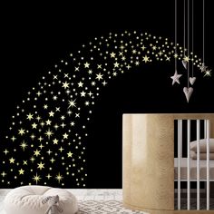 a baby's room with stars on the wall