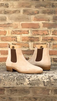 Discover the ultimate in style and craftsmanship with The Fulton St. Chelsea Boot No. 5675. Featuring taupe kid suede sides, front, and back strip paired beautifully with dark brown elastic for ease of entry. The interior boasts luxurious brown calf leather lining, sitting atop a durable natural leather sole. Handcrafted with a Goodyear Welt to ensure longevity, these boots blend elegance and practicality seamlessly. Perfect for any occasion that demands a touch of sophistication. Fitted Brown Chelsea Boots With Suede Lining, Brown Suede Chelsea Boots With Leather Sole, Classic Brown Chelsea Boots With Heel Pull Tab, Formal Goodyear Welted Suede Chelsea Boots, Luxury Brown Chelsea Boots With Goodyear Welt, Brown Slip-on Chelsea Boots With Suede Lining, Classic Brown Chelsea Boots With Rubber Heel Cap, Brown Suede Goodyear Welted Chelsea Boots, Classic Suede Chelsea Boots With Plain Toe