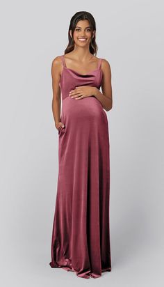 a pregnant woman in a purple gown