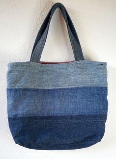 a denim bag hanging on the wall