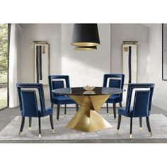 a dining room with blue chairs and a round table