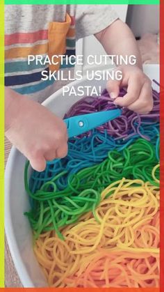 a child using scissors to cut colored pasta noodles with the words practice cutting skills using pasta