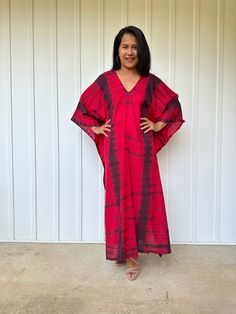 Unwind in absolute comfort with our semi sheer cotton gauze kaftan. This kaftan is perfect for the beach, pool, resort and laid-back time at home. Crafted from quality soft and breathable gauze cotton, it offers an airy fit that's ideal for lounging and cover up. Its relaxed design and easy slip-on style make it your go-to choice for outdoor cover up and relaxed nights at home. Red V-neck Free Size Kaftan, Casual Red V-neck Kaftan, Red Long Sleeve Beach Tunic, Casual Red Tunic For Vacation, Red Cotton Kaftan For Spring, Red Cotton Tunic For Summer, Red V-neck Kaftan For The Beach, Red V-neck Beach Dress Cover-up, Red Oversized Bohemian Kaftan