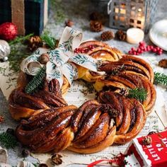 a christmas wreath shaped pastry sitting on top of a table