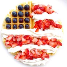 waffles with strawberries and blueberries on them are arranged in the shape of an american flag