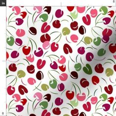 a white background with red, green and pink cherries on it