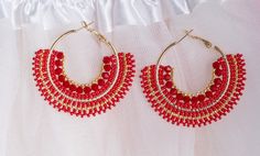 Large Boho earrings in a summer look, the fresh color combination of red and gold immediately creates a festive atmosphere and an elegant look. Large boho earrings that call for a festival or a little gift for a loved one. It is also an elegant addition to your outfit for an evening walk on the beach. Vielen Dank für Ihren Besuch in meinem Shop, und wenn Sie Fragen haben, zögern Sie nicht, mich zu kontaktieren. Handmade Red Hoop Earrings For Beach, Red Bohemian Hoop Earrings For Summer, Red Round Beaded Party Earrings, Red Bohemian Hoop Earrings For Beach, Bohemian Red Hoop Earrings For Beach, Elegant Red Beaded Hoop Earrings, Elegant Red Hoop Earrings, Red Round Earrings For Beach, Red Round Beach Earrings