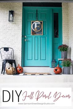 a blue front door with pumpkins and other decorations on the steps next to it